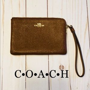 COACH saddle brown leather wristlet